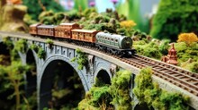  A Model Of A Train On A Bridge With Trees And Bushes On Both Sides Of The Bridge And A Train On The Other Side Of The Bridge.