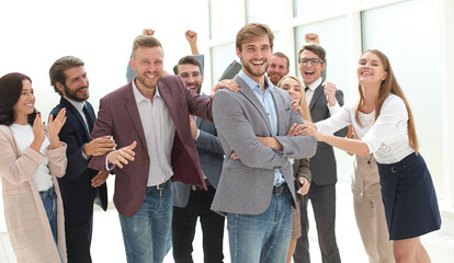 Wall Mural - smiling entrepreneur on the background of jubilant business team