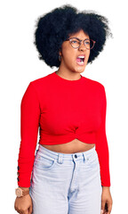 Sticker - Young african american girl wearing casual clothes and glasses angry and mad screaming frustrated and furious, shouting with anger. rage and aggressive concept.