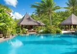 Fototapeta Sypialnia - Stunning landscape, swimming pool blue sky with clouds. Tropical resort hotel in Maldives. Fantastic relax and peaceful vibes, chairs, loungers under umbrella and palm leaves. Luxury travel vacation
