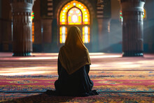 Muslim Woman Praying In Mosque. Sunlight Rays And Haze Through The Window