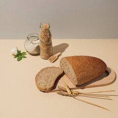 Close-up of bread, wheat and wholemeal flour on the table. Concept of healthy food