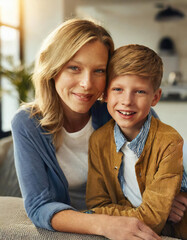 Affectionate moment between smiling mother and son at home, showcasing a warm, loving family dynamic