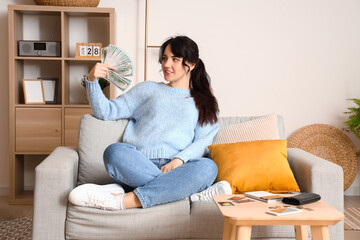 Sticker - Young woman with money  at home