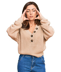 Wall Mural - Young brunette woman wearing casual winter sweater with hand on head for pain in head because stress. suffering migraine.