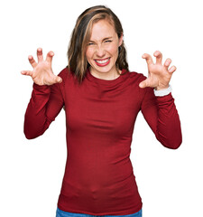 Poster - Young blonde woman wearing casual clothes smiling funny doing claw gesture as cat, aggressive and sexy expression