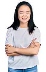 Wall Mural - Young chinese woman wearing casual white t shirt happy face smiling with crossed arms looking at the camera. positive person.