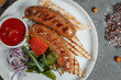 Grilled tasty bratwurst sausages on the plate