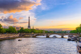 Fototapeta Paryż - Sunset view of Eiffel tower and Seine river in Paris, France. Eiffel Tower is one of the most iconic landmarks of Paris. Cityscape of Paris