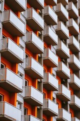 Aufkleber - A contemporary orange and white building with multiple balconies. Perfect for architectural and real estate purposes