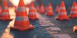 Orange and white cones arranged on a road, suitable for traffic control or construction purposes