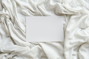 Poster - A sheet of paper placed on a neatly made bed with white sheets. Suitable for various concepts and themes