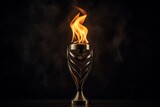 Fototapeta  - Iconic glow: Olympic flame shines brightly against a deep black setting.