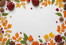 Autumn-themed Floral Arrangement With Oak Leaves, Cones, Flowers, And Berries On White Background With Space For Text