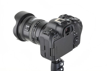 Big Black and Modern digital mirrorless Camera full frame sensor with lens on white background.