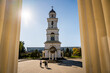 people passing by orthodox church in chisinau on sunny day