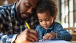 Father and son drawing together with a focus on learning