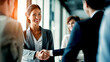 Business Woman Shaking Hands with A Man in the Office. Congratulations to Him on His Cooperation. Business Environment
