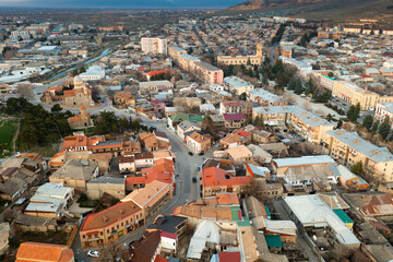 Wall Mural - View from drone of houses at Gori town at spring day, eastern Georgia