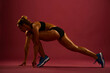 © serhii - woman in a sporty start pose