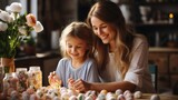 Fototapeta  - happy mother and kid painting easter eggs on kitchen at home.