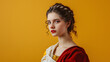 Portrait of a beautiful woman in ancient roman clothes isolated on a yellow background