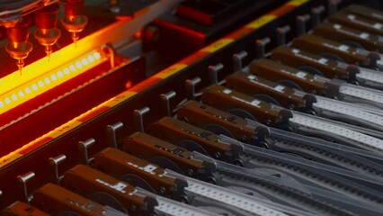 Poster - Close up of details of automatic SMD pick and place machine during work. Creative. Assembly of computer printed circuit board at factory.