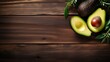 A large avocado on a wooden background. Fresh summer products and healthy fruits in close-up for the market of eco-farms, dietary nutrition.