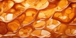 A macro shot capturing the intricate patterns formed by the caramelization process on a piece of peanut brittle, highlighting its unique and visually appealing appearance.