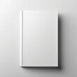 © Wasinee - A Minimalist Mockup Blank White Book on a Grey Background