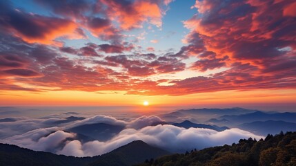 Wall Mural - aerial view of the sun setting over the clouds, creating a colorful and dramatic sky