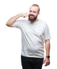 Sticker - Young caucasian hipster man wearing casual t-shirt over isolated background smiling doing phone gesture with hand and fingers like talking on the telephone. Communicating concepts.