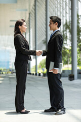 Chinese Business people shaking hands