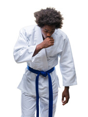 Sticker - Afro american man wearing karate kimono over isolated background feeling unwell and coughing as symptom for cold or bronchitis. Healthcare concept.