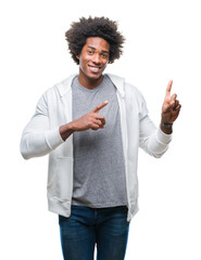 Poster - Afro american man wearing sweatshirt over isolated background smiling and looking at the camera pointing with two hands and fingers to the side.