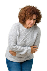 Poster - Beautiful middle ager senior woman wearing winter sweater over isolated background with hand on stomach because nausea, painful disease feeling unwell. Ache concept.