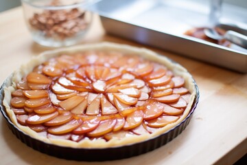 raw tarte tatin before baking with uncooked pastry