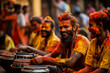 Men smeared with colorful powders play drums during Holi, India's vibrant festival of colors, symbolizing joy and the triumph of good over evil