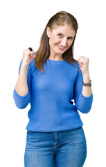 Poster - Beautiful middle age mature woman wearing winter sweater over isolated background looking confident with smile on face, pointing oneself with fingers proud and happy.