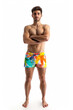 © Keitma - Picture of an handsome young man in colorful swimwear full body view isolated on white background