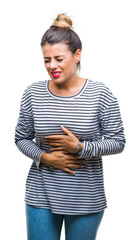 Poster - Young beautiful woman casual stripes sweater over isolated background with hand on stomach because indigestion, painful illness feeling unwell. Ache concept.