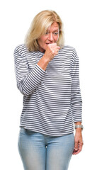 Wall Mural - Middle age blonde woman over isolated background feeling unwell and coughing as symptom for cold or bronchitis. Healthcare concept.