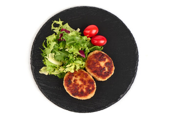 Wall Mural - Roasted meatballs in breadcrumbs with mix salad, close-up, isolated on a white background.