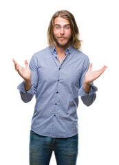 Sticker - Young handsome man with long hair over isolated background clueless and confused expression with arms and hands raised. Doubt concept.