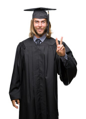 Poster - Young handsome graduated man with long hair over isolated background smiling looking to the camera showing fingers doing victory sign. Number two.