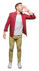 Poster - Handsome man wearing casual shirt shouting and screaming loud to side with hand on mouth. Communication concept.