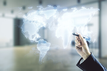 Poster - Multi exposure of businessman hand with pen working with abstract creative digital world map hologram on blurred office background, research and analytics concept