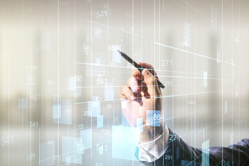 Poster - Multi exposure of businessman hand with pen working with creative statistics data hologram on blurred office background, stats and analytics concept