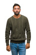 © Krakenimages.com - Adult hispanic man wearing winter sweater over isolated background with serious expression on face. Simple and natural looking at the camera.
