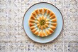baklava arranged in a circular pattern on a platter